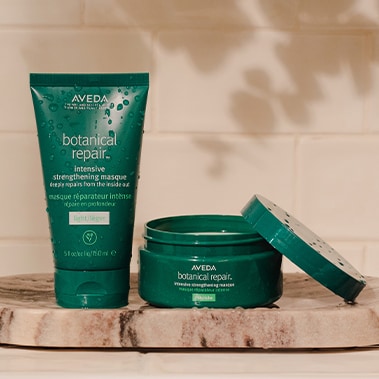 Product imagery of botanical repair™ intensive strengthening masques in light and rich.
