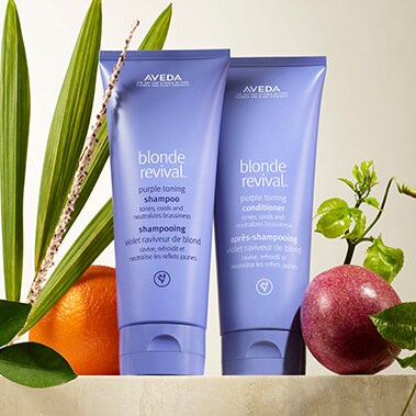 Product imagery of blonde revival™ purple toning shampoo and conditioner.