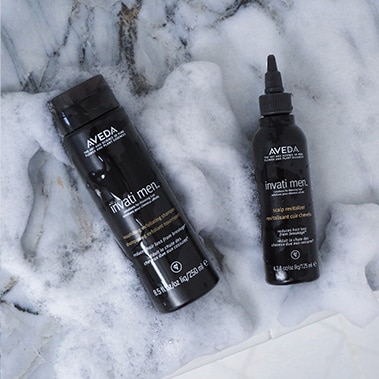 Client imagery of invati men™ nourishing exfoliating shampoo and invati men™ scalp revitalizer. 